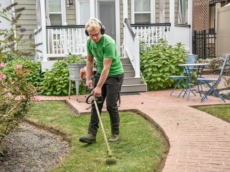 Landscaper trimming a yard